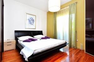 Posteľ alebo postele v izbe v ubytovaní Apartment SAKAL