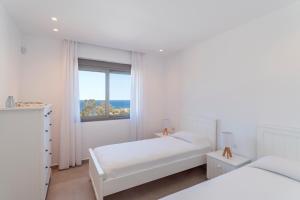 Postel nebo postele na pokoji v ubytování Terra d'Oro Sea view villa with private pool