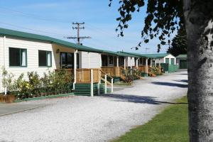 a row of houses with green roofs at Taupo TOP 10 Holiday Park in Taupo