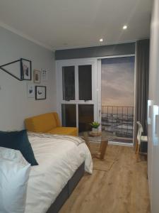 Ένα ή περισσότερα κρεβάτια σε δωμάτιο στο Executive Condo Studio Apartments