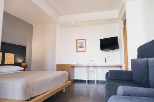 TV a/nebo společenská místnost v ubytování Modica Palace Hotel