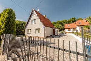 a house with a fence in front of it at Stara Piekarnia - Plac Lotników in Olsztyn