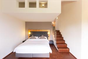 Postel nebo postele na pokoji v ubytování Hotel UTO KULM car-free hideaway in Zurich