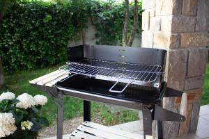 a barbecue grill sitting outside in a yard at Seaview Heights above Portorož in Izola