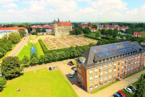 an aerial view of a building with a large courtyard at Ferienwohnung Schlossblick in Güstrow