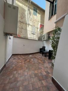 a room with a brick floor and a building at L'ANTICA FALCONERIA in Iesi