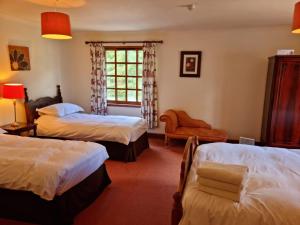 Ένα ή περισσότερα κρεβάτια σε δωμάτιο στο Killean Farmhouse B&B