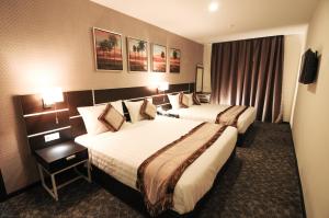 Postel nebo postele na pokoji v ubytování K Garden Hotel Parit Buntar + 31 fotografií