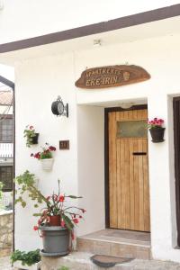 a building with a door and a sign on it at Eke Irin Apartments in Ohrid