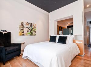 Katil atau katil-katil dalam bilik di Apartamento en pleno Gran Via I