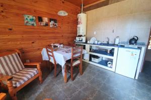 A cozinha ou cozinha compacta de Cabañas Normana Inn