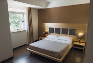 Postel nebo postele na pokoji v ubytování Modica Palace Hotel