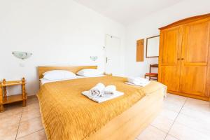 Postel nebo postele na pokoji v ubytování Apartments Cvito