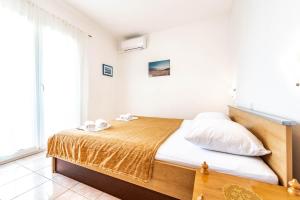 Postel nebo postele na pokoji v ubytování Apartments Cvito