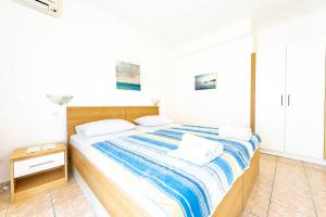 Postel nebo postele na pokoji v ubytování Apartments Cvito