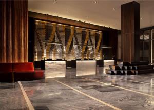 a lobby with a red chair in a building at Grand Hyatt Nashville in Nashville