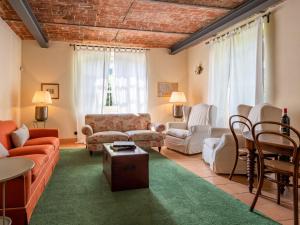 a living room with a couch and chairs at Holiday Home Villa Remotti by Interhome in Fubine