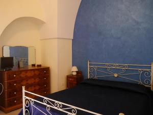 Un pat sau paturi într-o cameră la Casa Destradis B&B