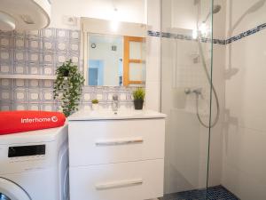a bathroom with a sink and a shower at Apartment Coulaoun by Interhome in Biarritz