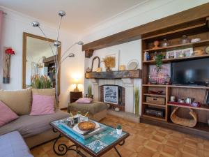 a living room with a couch and a fireplace at Apartment Eskil Kanta by Interhome in Saint-Jean-de-Luz