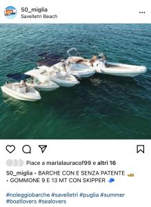 a screenshot of four boats in the water at Sweet Home Suite in Fasano