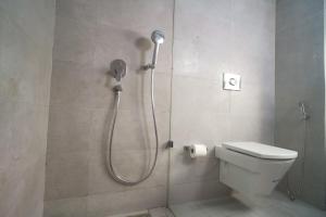 a shower in a bathroom with a toilet at Maarif Home Casablanca in Casablanca +46 photos