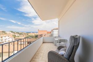 a balcony with chairs and a view of the ocean at B&B Antico Telaio in Santa Maria Navarrese