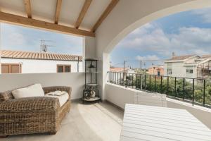 a living room with a couch and a balcony at B&B Antico Telaio in Santa Maria Navarrese