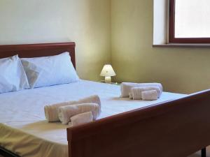 Letto o letti in una camera di Via Ugento Apartments - a pochi passi dalle spiagge