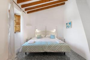 Postel nebo postele na pokoji v ubytování Villa Santanyí, Sueño de Verano