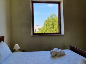 Letto o letti in una camera di Via Ugento Apartments - a pochi passi dalle spiagge