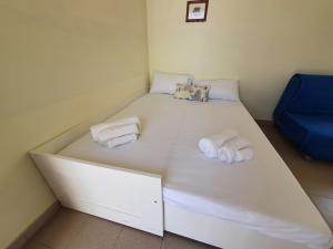 Letto o letti in una camera di Via Ugento Apartments - a pochi passi dalle spiagge