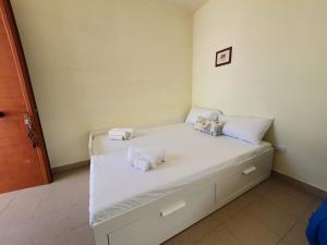Letto o letti in una camera di Via Ugento Apartments - a pochi passi dalle spiagge