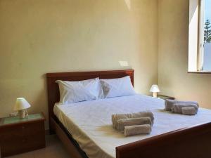 Letto o letti in una camera di Via Ugento Apartments - a pochi passi dalle spiagge
