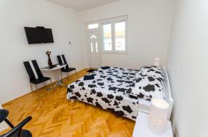 Postel nebo postele na pokoji v ubytování Apartments Ivana + 31 fotografií
