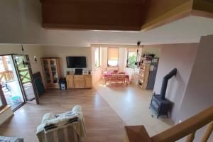 a living room with a wood burning stove in it at Domek na Polnej in Czorsztyn
