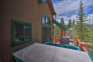 a house with a bed on the outside of it at Beautiful Breck Retreat Walk to Gondola and Main St in Breckenridge