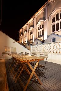 a wooden table sitting on top of a building at Apartment Junqueiro in Porto