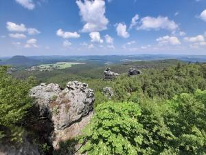 an aerial view of a large rock and trees at FeWo Bockmühle in Hohnstein +4 photos