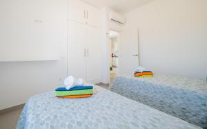 Posteľ alebo postele v izbe v ubytovaní Cubo's Villa Pilar