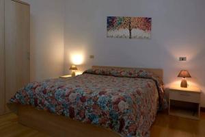 Ένα ή περισσότερα κρεβάτια σε δωμάτιο στο La Casa di Gloria - Residence affitta camere