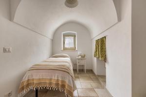 Posteľ alebo postele v izbe v ubytovaní Trullo Ventura by BarbarHouse