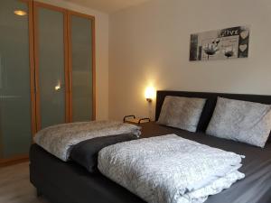 Een bed of bedden in een kamer bij Grönebach A