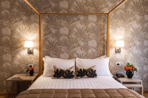 Ένα ή περισσότερα κρεβάτια σε δωμάτιο στο Hotel Porta San Mamolo