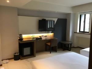Voodi või voodid majutusasutuse Fu Kuang Hotel toas