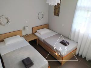 Posteľ alebo postele v izbe v ubytovaní S&S Home