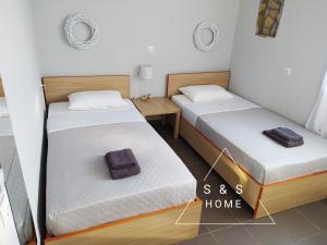 Postel nebo postele na pokoji v ubytování S&S Home