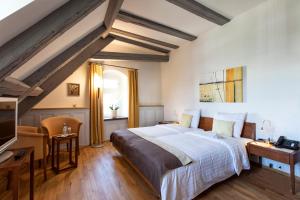 Ένα ή περισσότερα κρεβάτια σε δωμάτιο στο Hotel de Charme Römerhof