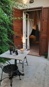 a table and a chair on a patio at B&B del Giglio in Cefalù