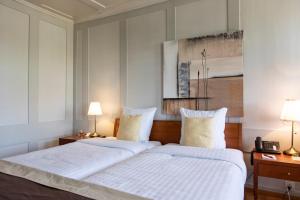 Ένα ή περισσότερα κρεβάτια σε δωμάτιο στο Hotel de Charme Römerhof
